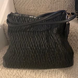 Coach used very few with a dust bag very unique design good size even for travel